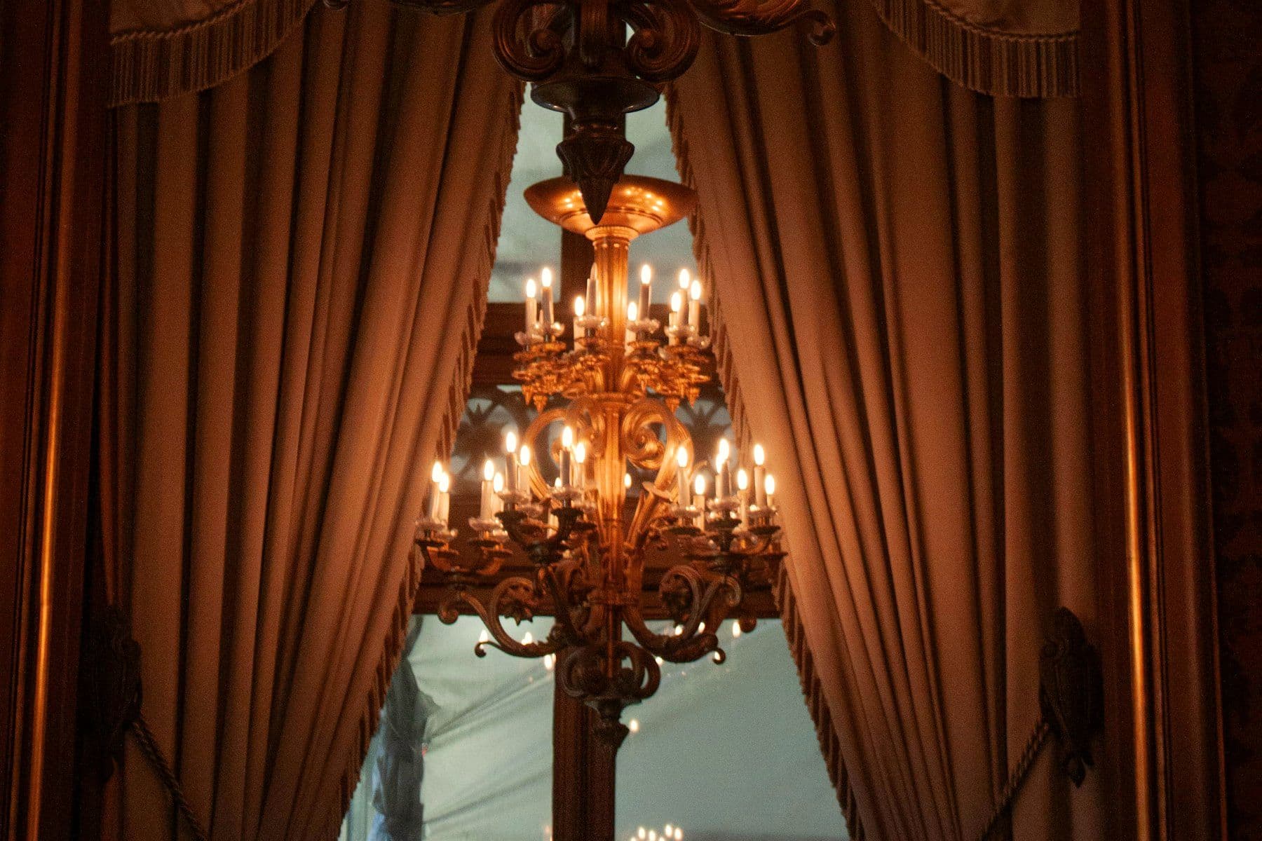 Venue lit with chandeliers and warm accent lighting