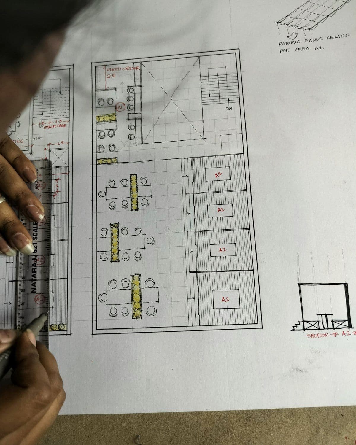 Design drawings and material samples laid out for review
