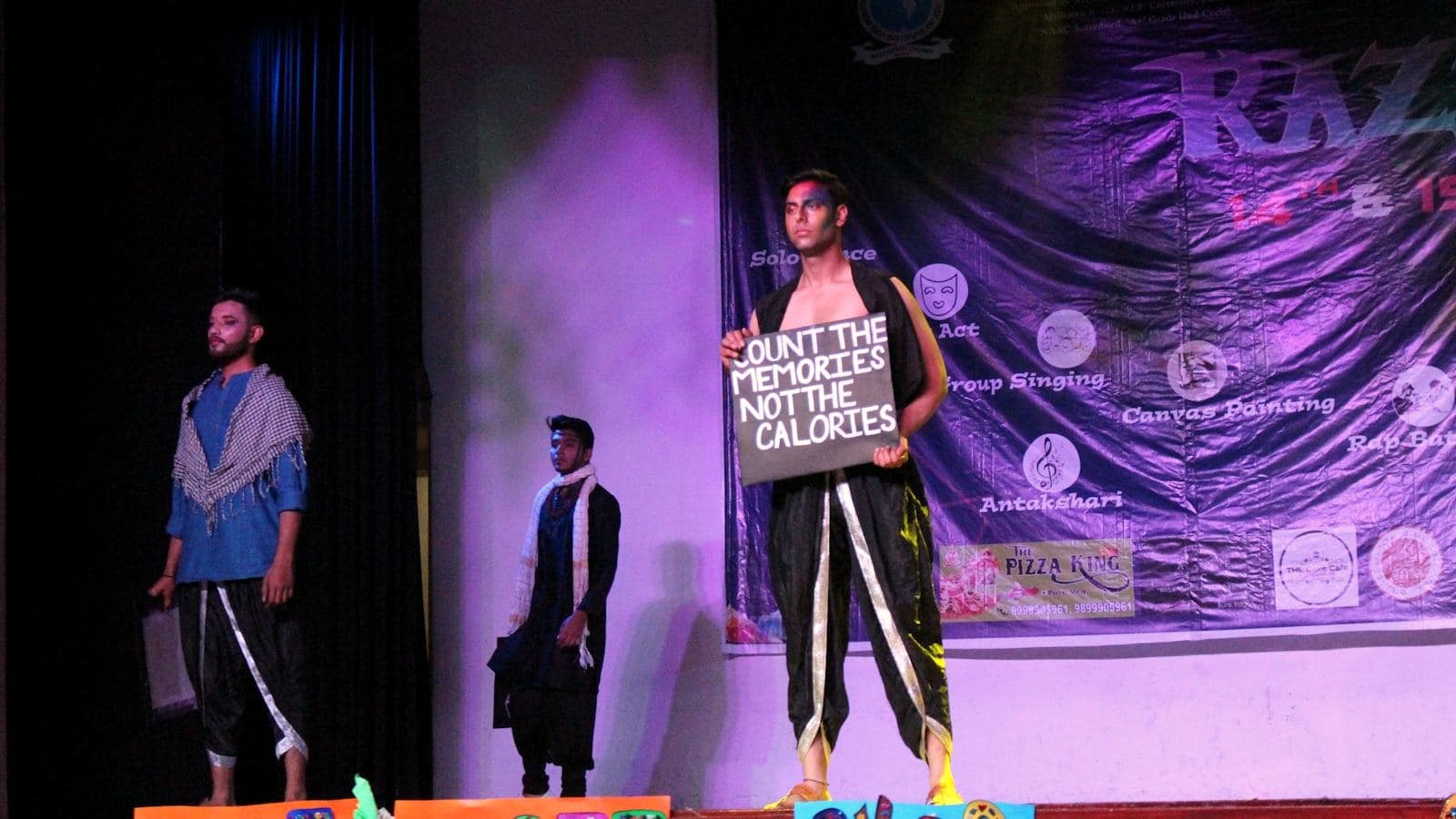 Two presenters on stage at a corporate event