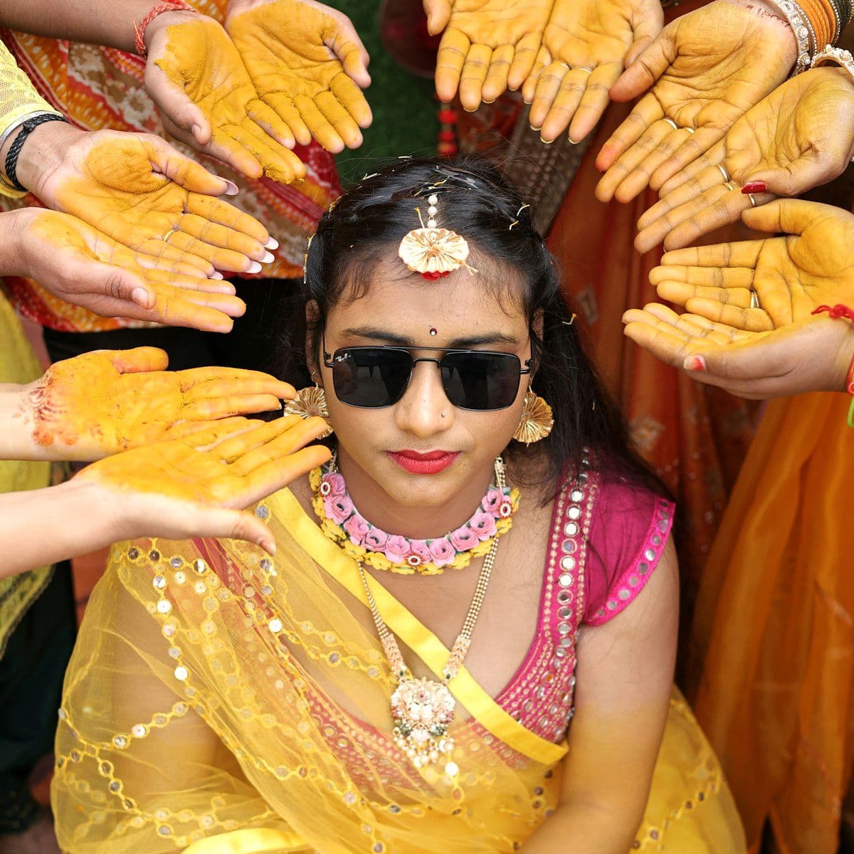 Haldi ceremony in progress with turmeric and marigolds