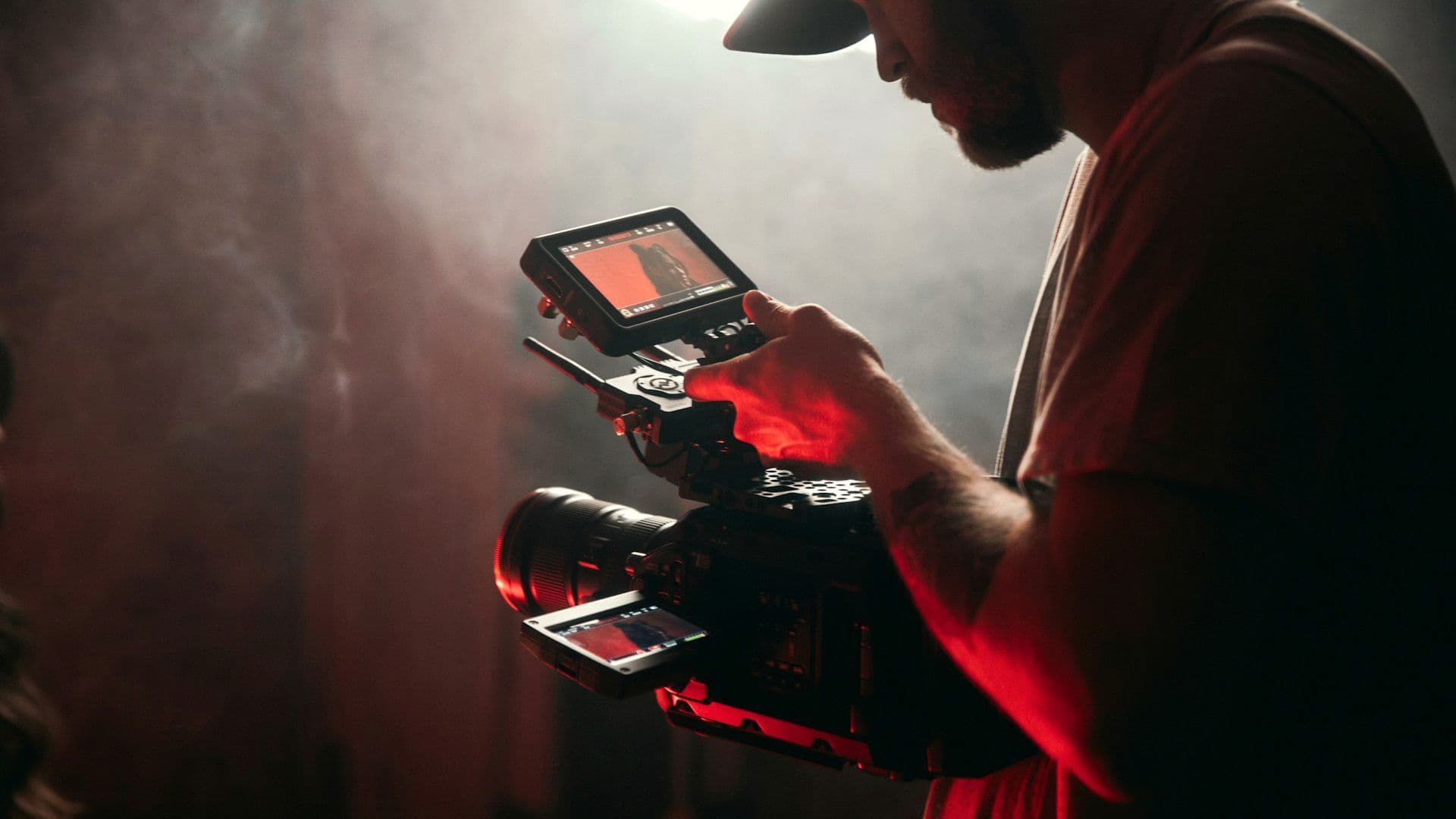 Camera operator filming live during the event