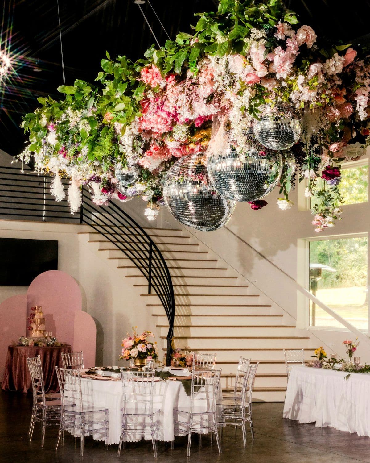Fresh floral canopy suspended above the dining space