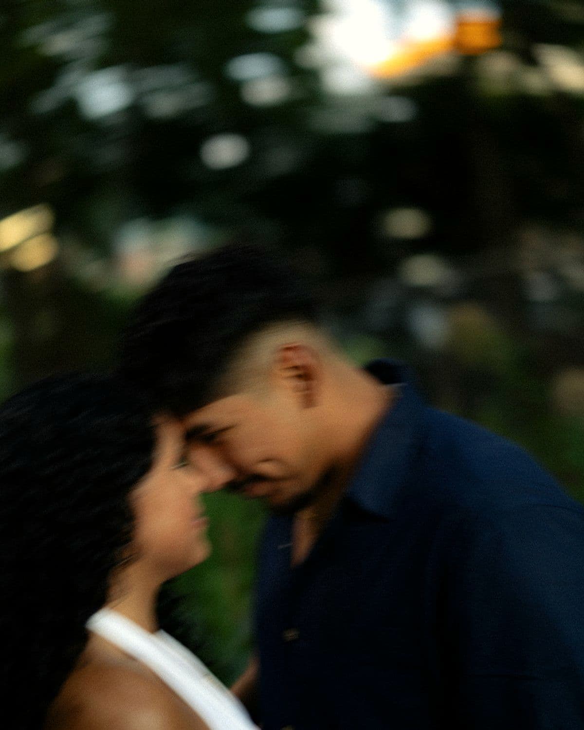 Couple photographed together at golden hour