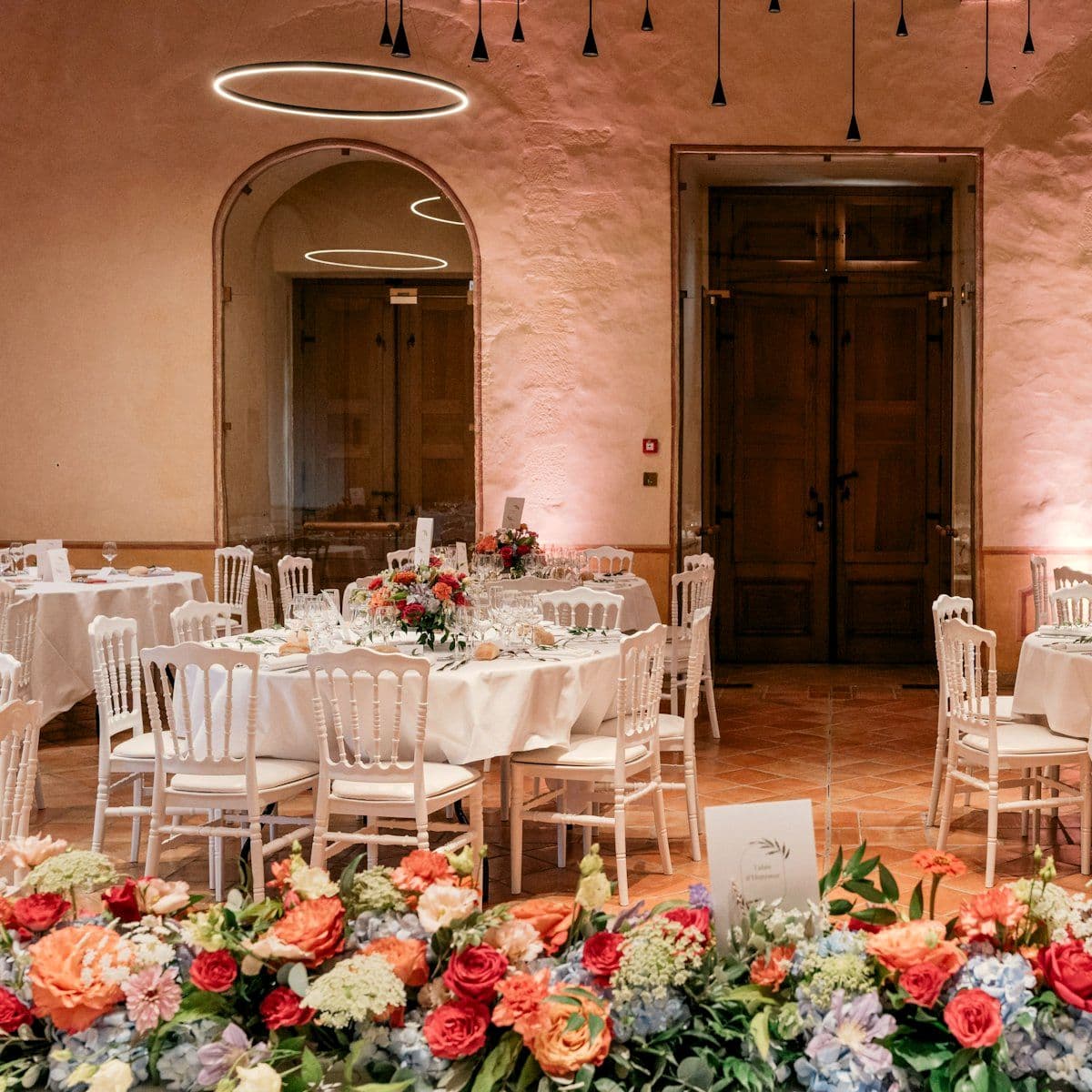 Reception tables styled with floral centrepieces