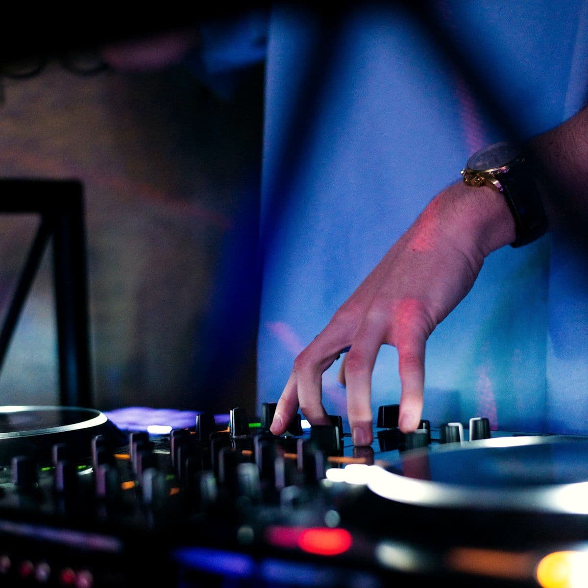 DJ mixing at the console during an evening set