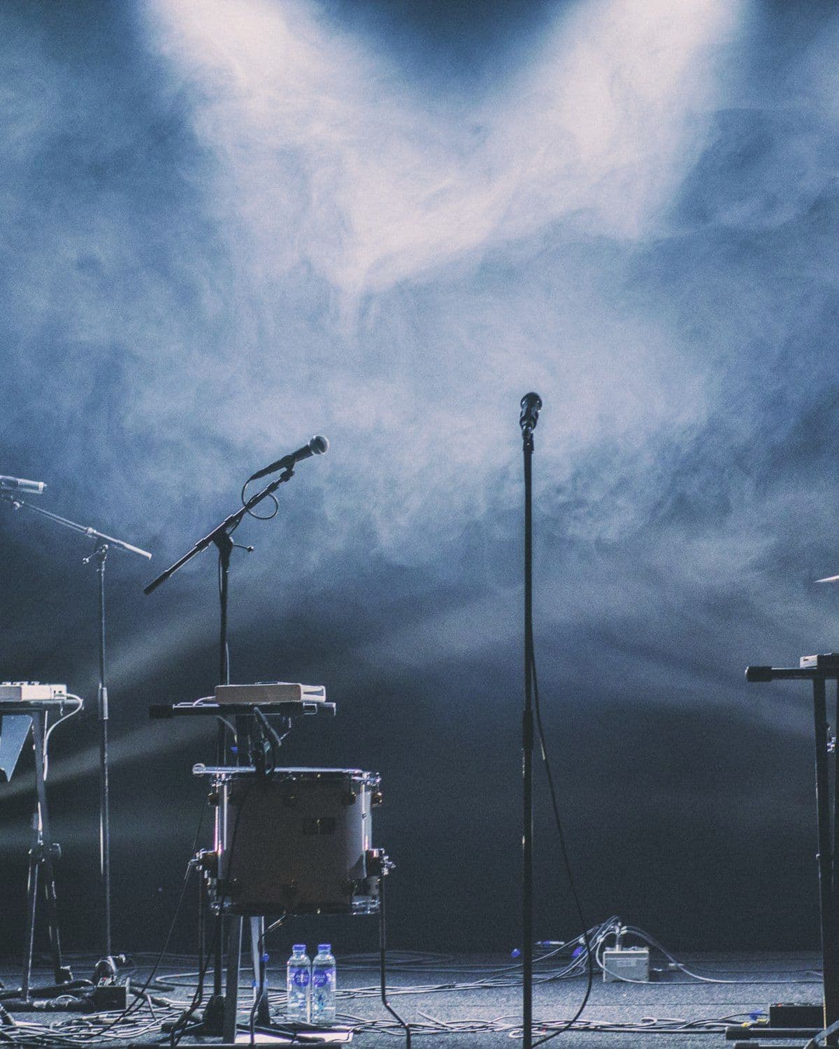 Instruments and microphones set up before a performance