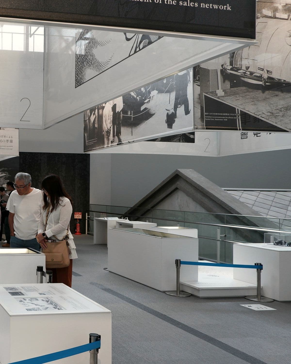 Visitors exploring exhibits inside a modern brand space