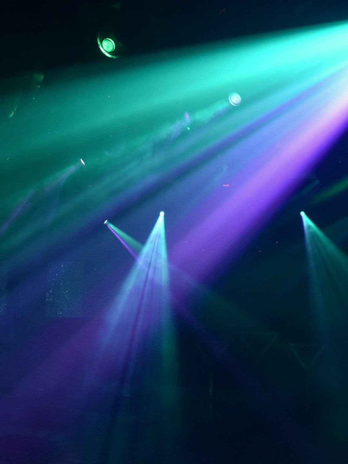 Launch stage cut through with coloured beam lighting