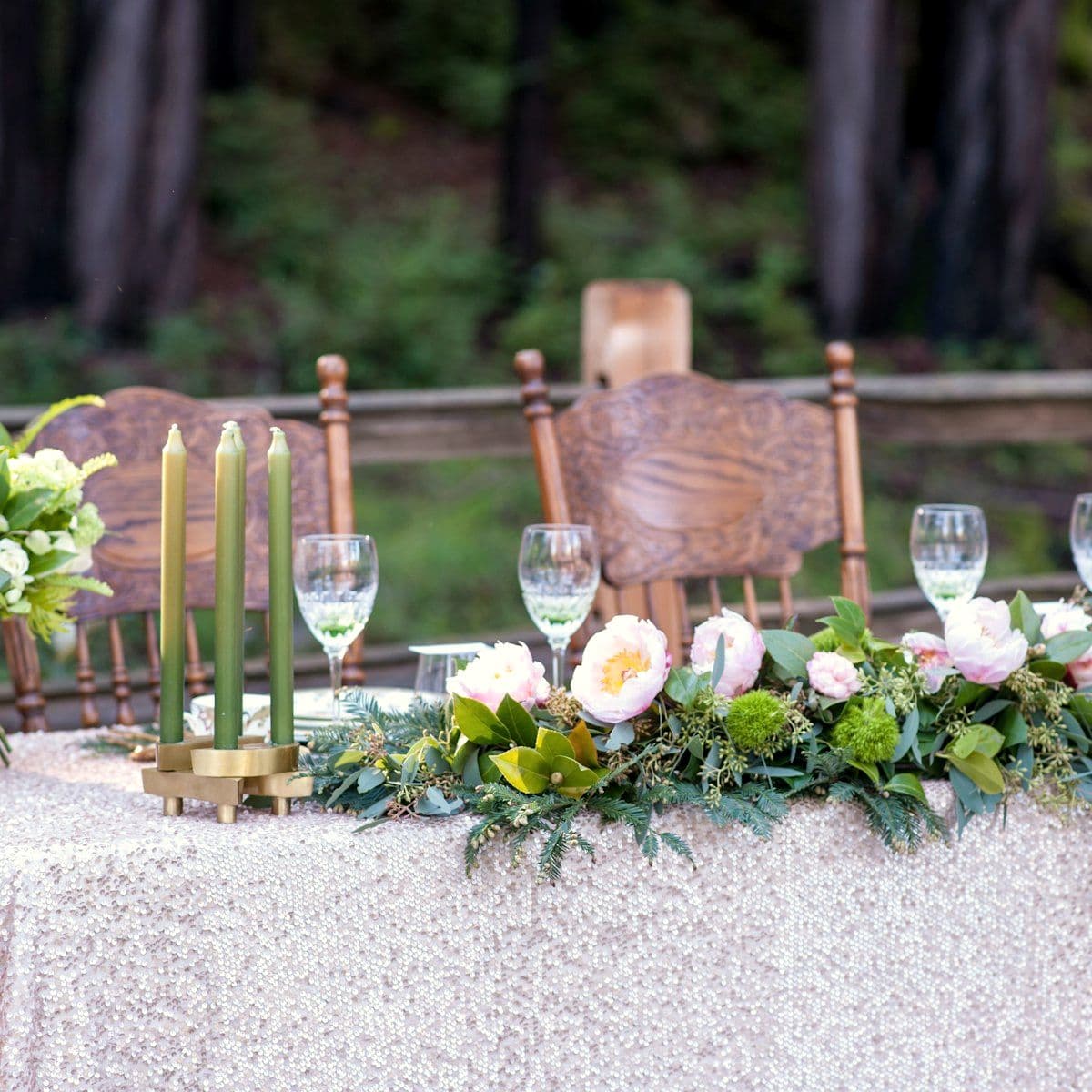 Table styled with candles, glassware and low florals