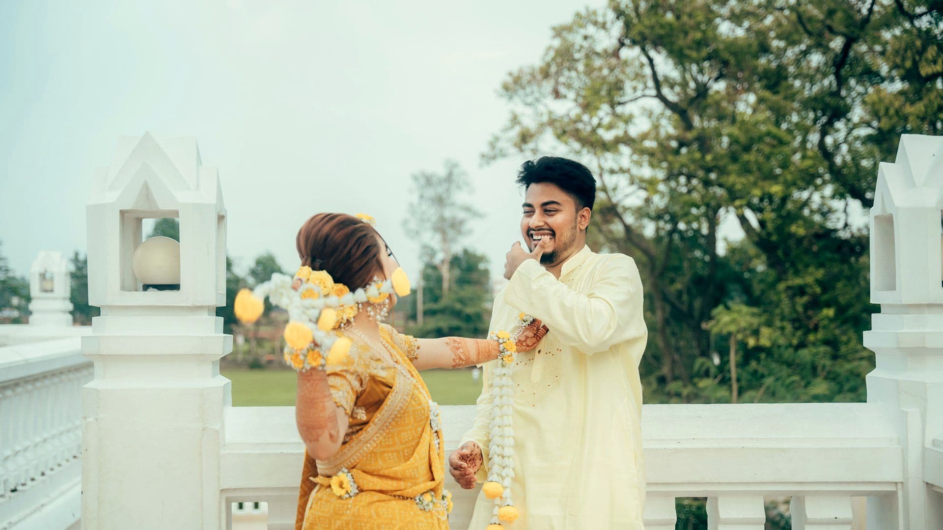 Couple exchanging flower garlands during the celebration