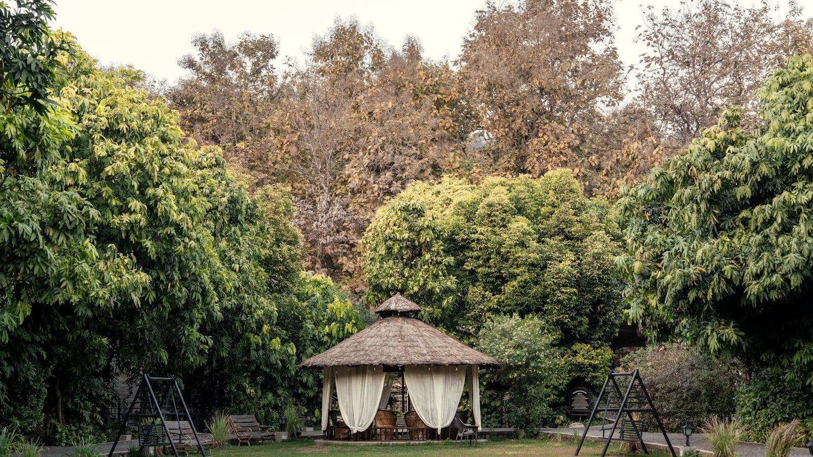 Thatched garden pavilion at a farmhouse venue