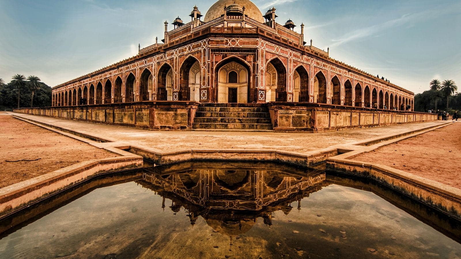 Mughal-era monument and reflecting pool in Delhi