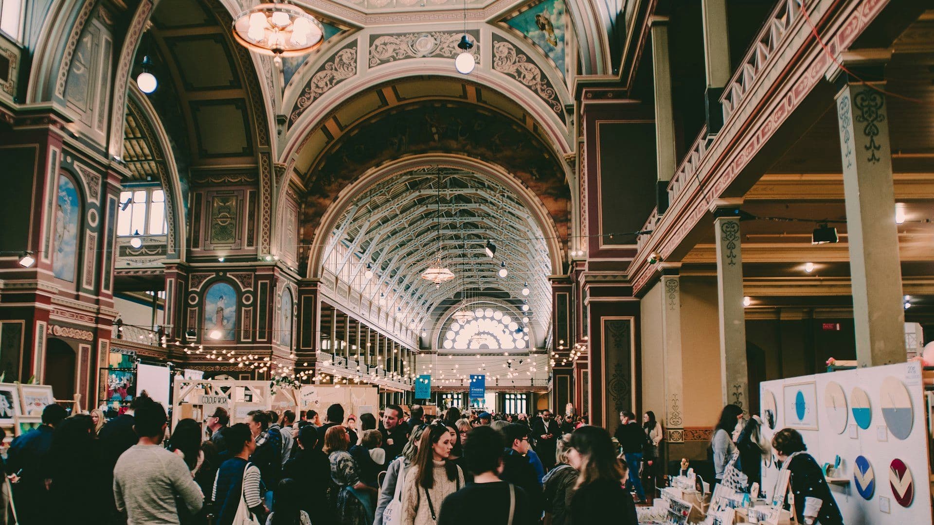 Exhibition hall aisle busy with delegates