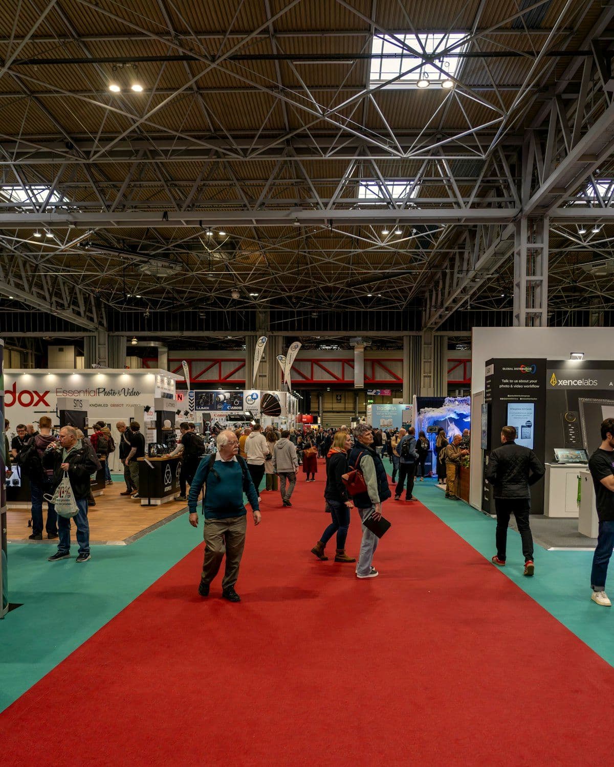 Visitors gathered around an exhibition stand