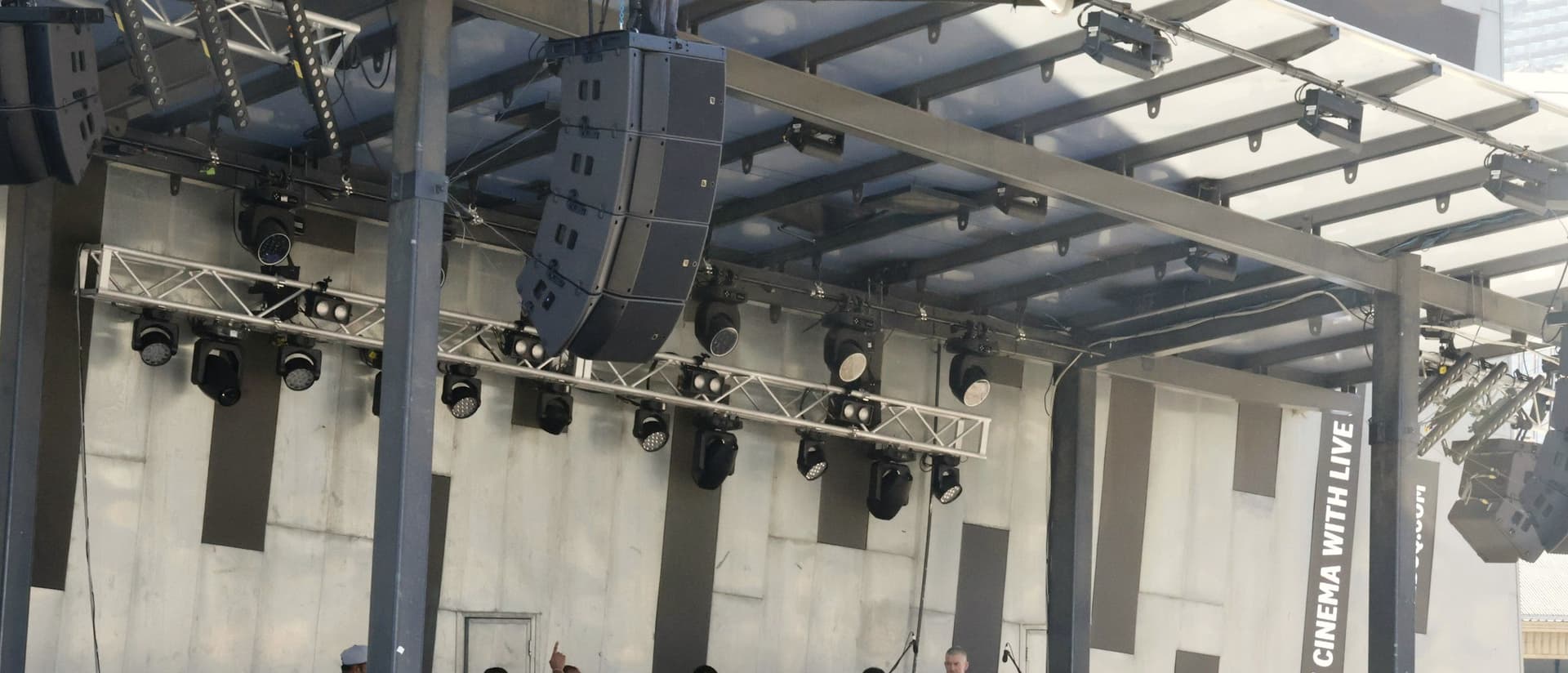 Team preparing an outdoor stage ahead of an event