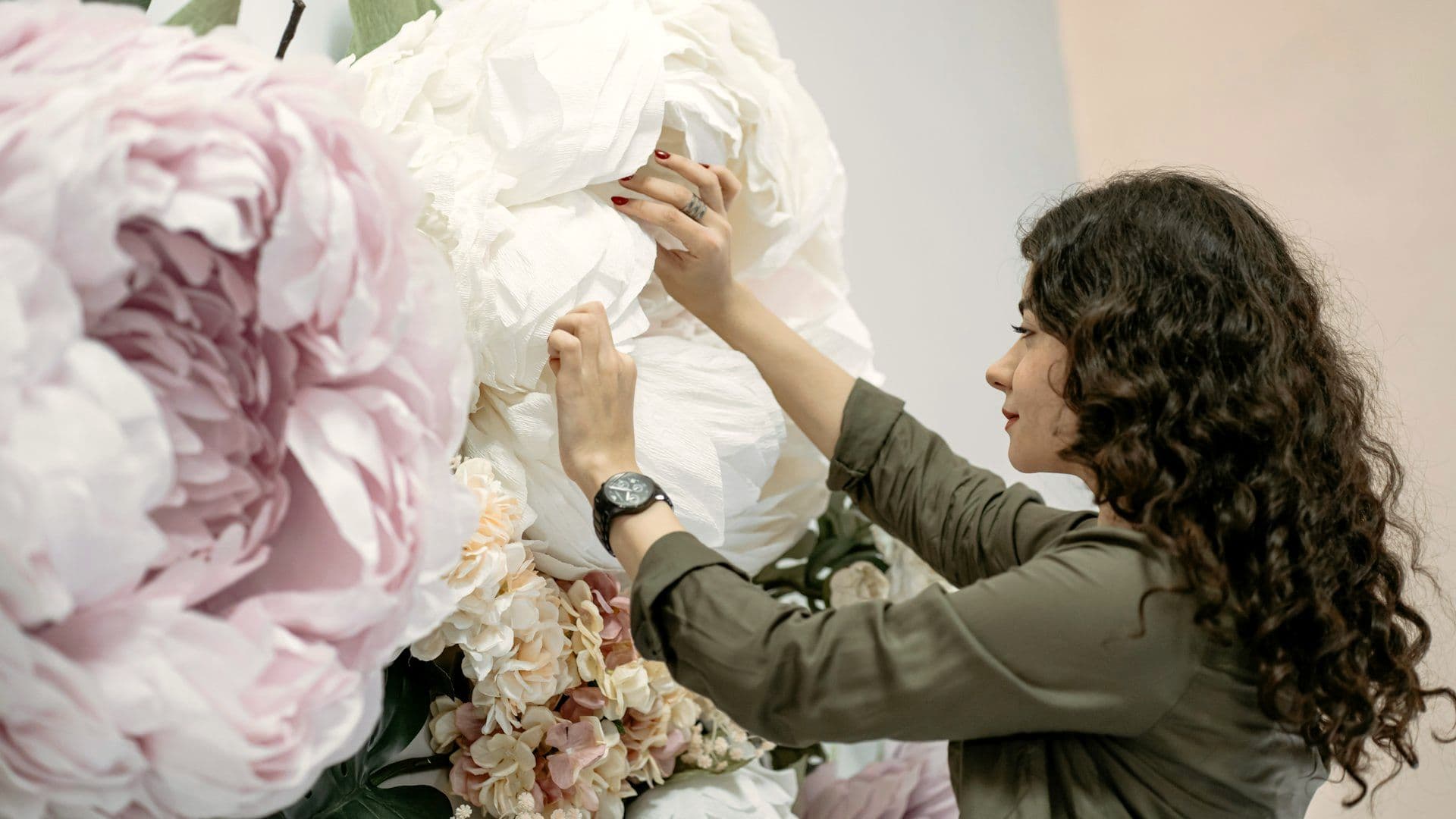 Florist assembling a large installation early in the morning