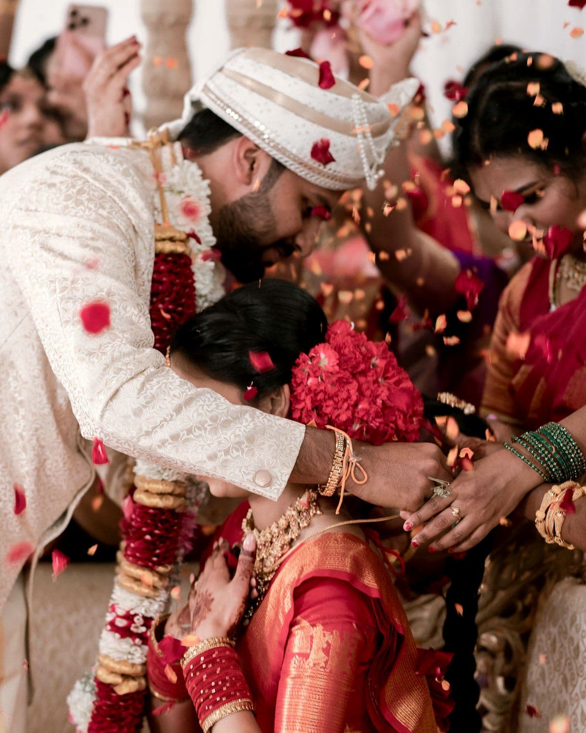 Couple showered with flower petals during the ceremony